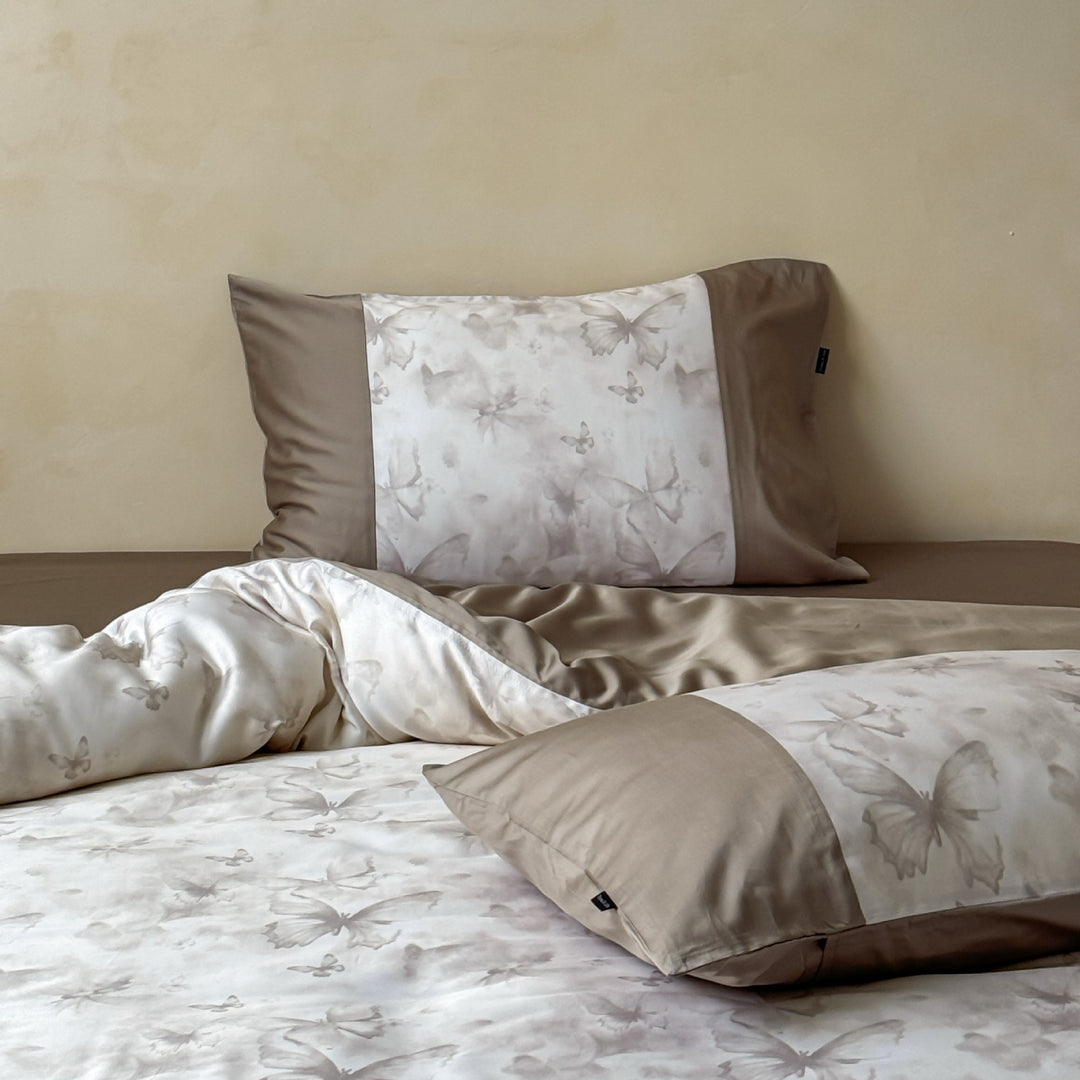 Bedding set made of cotton satin with woven butterfly jacquard and contrasting border