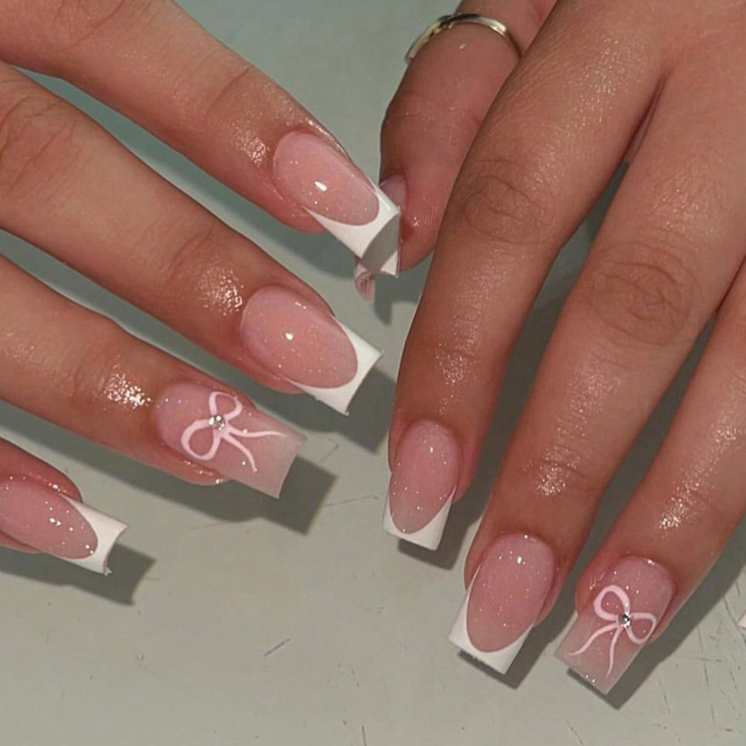 Nail art set with elegant bow and glitter accents Kalsten