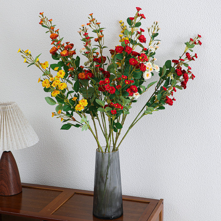 Artificial branch with decorative flowers