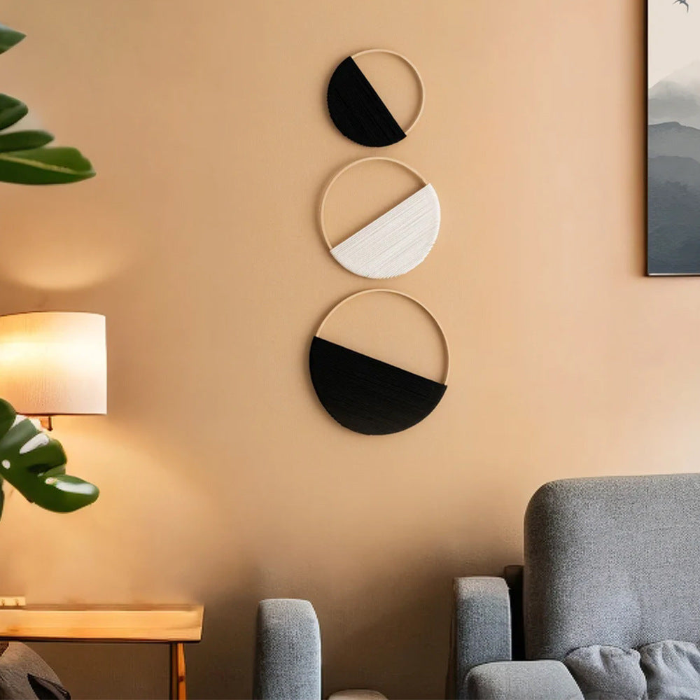 Modern wall art piece made of macrame and wood