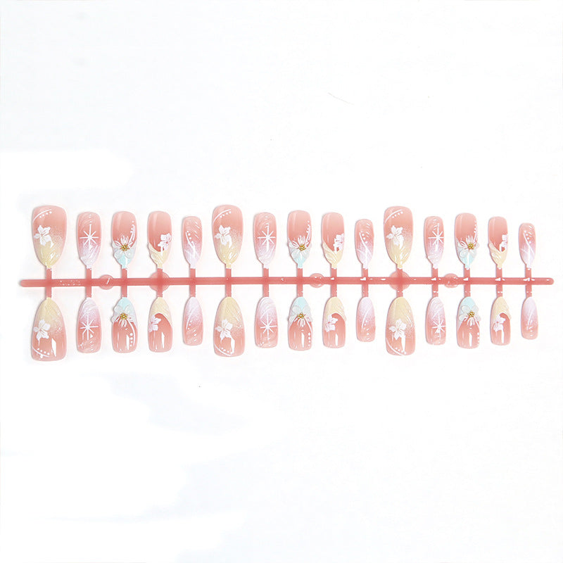Artificial nail set with intricately detailed floral designs and shine accents Kalsten