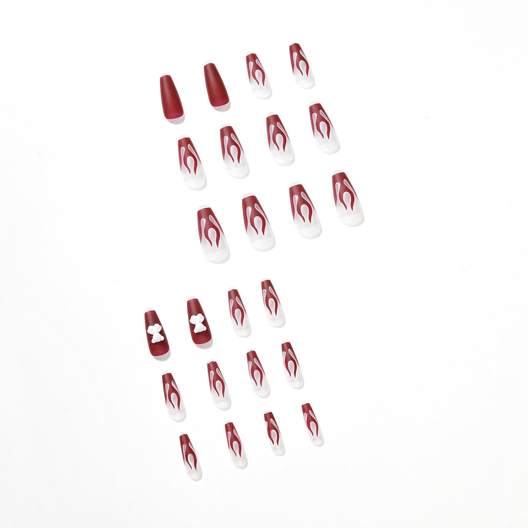 Artful stiletto nails with fiery flame design Kalsten