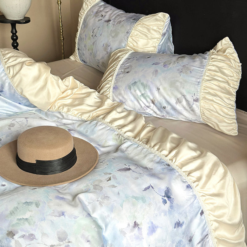 Elegant satin bedding set with watercolor floral pattern, ruffles and gathered pillowcases