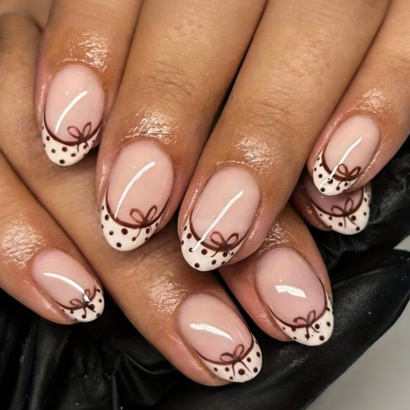 Artificial nail set with elegant bow and dot patterns Kalsten