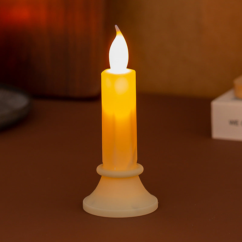 Flickering LED pillar candle in real wax look with removable holder