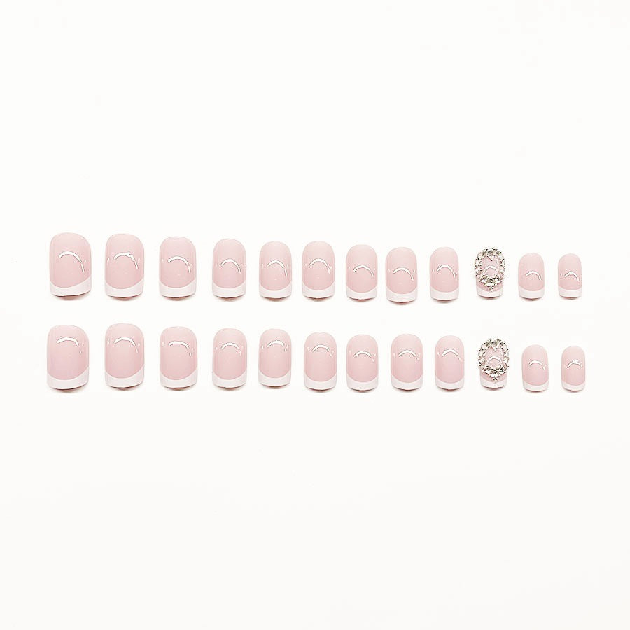 Artificial nail set with elegant French design and rhinestone embellishments Kalsten