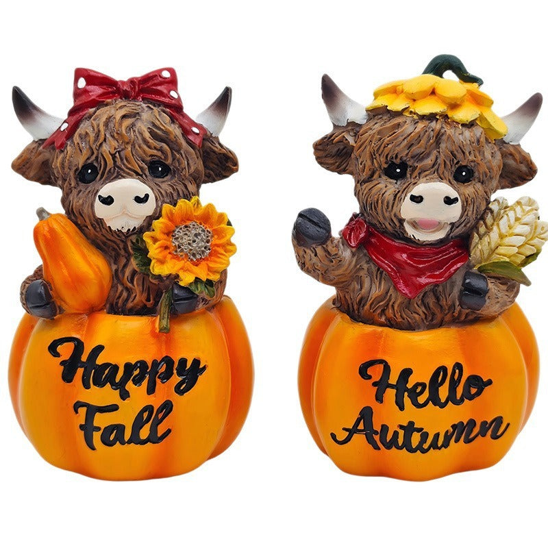 Funny decorative figure of a Highland cow in pumpkin costume Kalsten