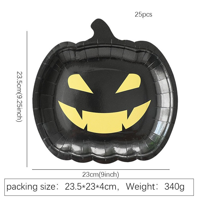 Disposable paper plates in pumpkin shape with spooky face design