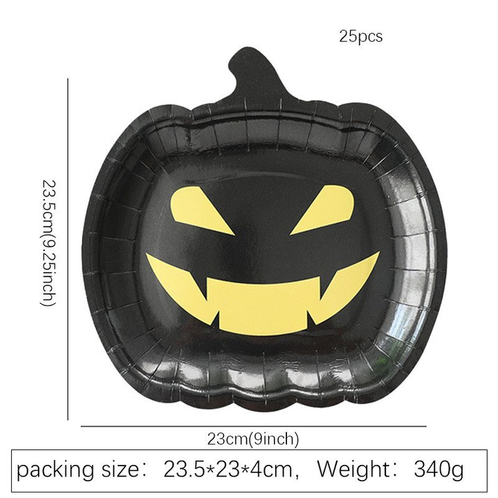 Disposable paper plates in pumpkin shape with spooky face design