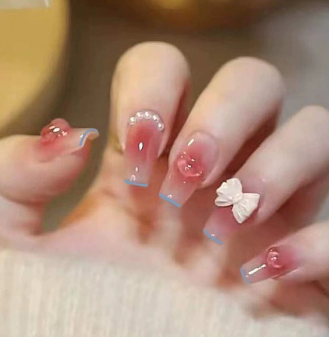 Elegant nail design with pearl embellishment Kalsten