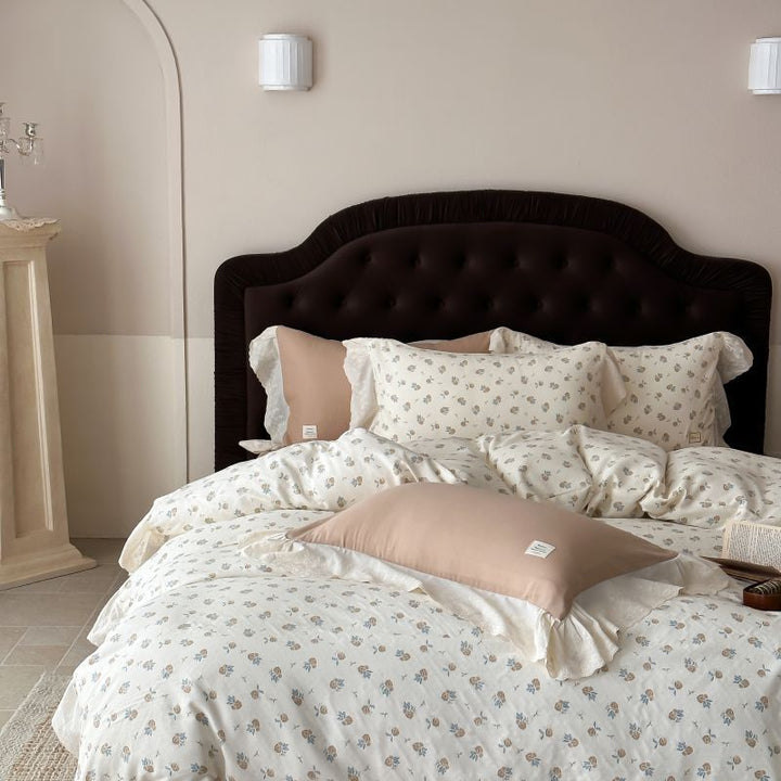 Luxurious cotton satin bed linen set in vintage style with delicate floral pattern and lace trim