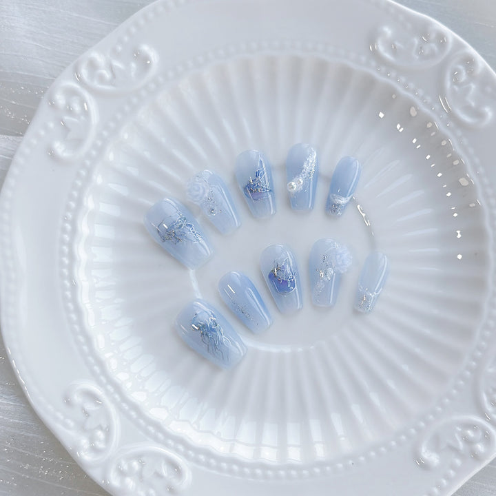 Artistic Press-On Nail Set with Sea-Inspired Designs