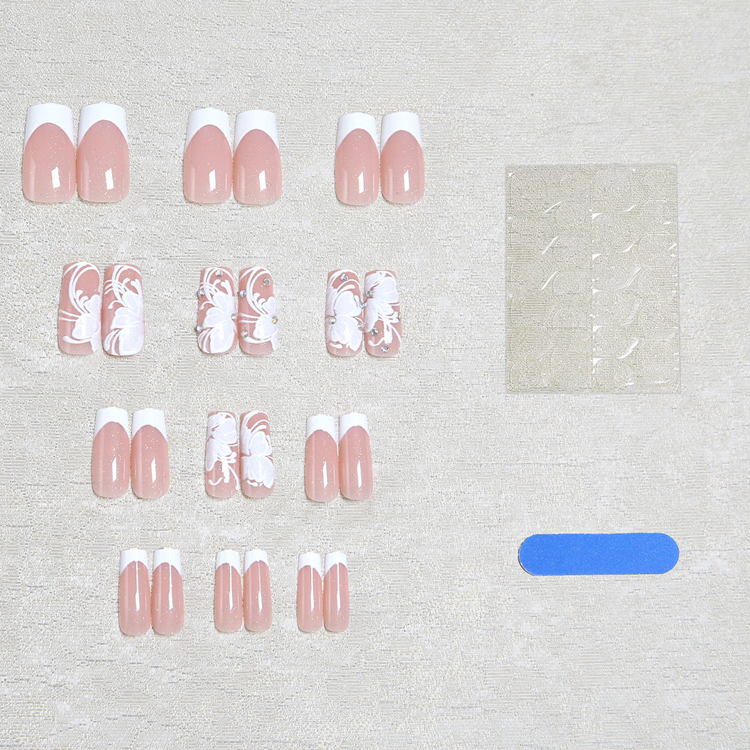 Artificial nails with floral embellishments and glitter details Kalsten