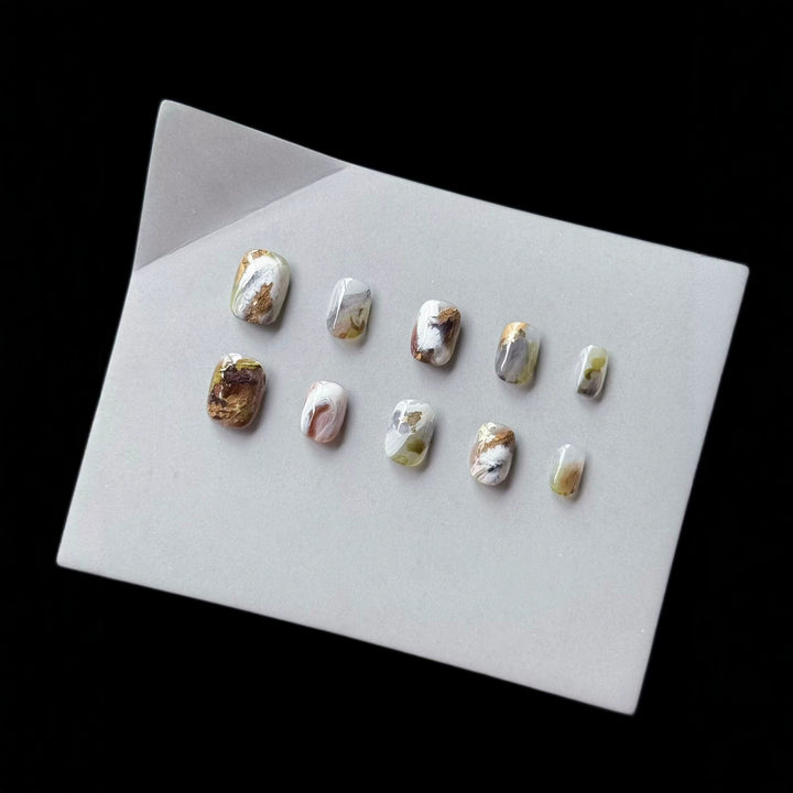 Artistic Press-On Nail Art Set with Marble and Gold Accents