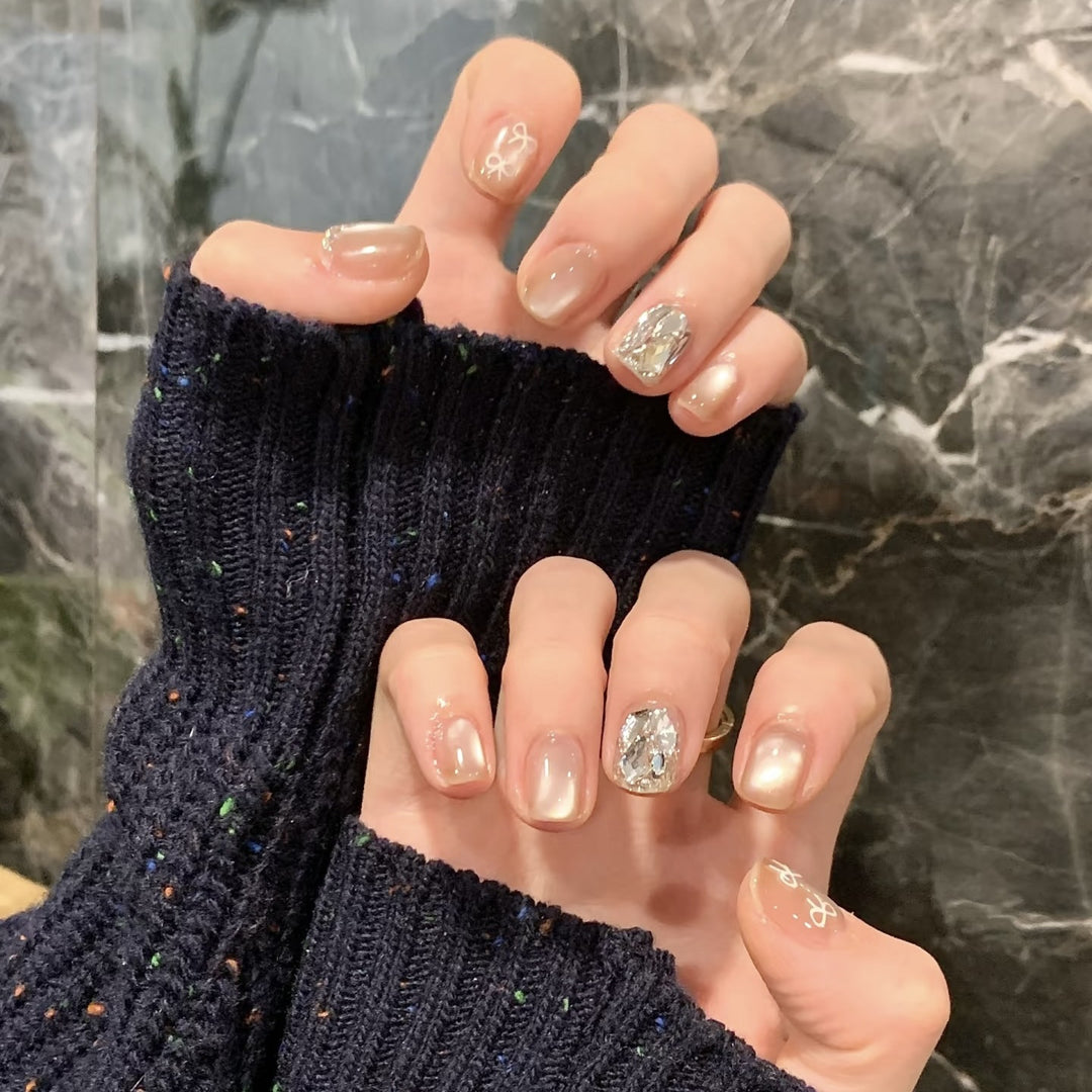 Elegant artificial nails with shimmering glitter and floral details Kalsten