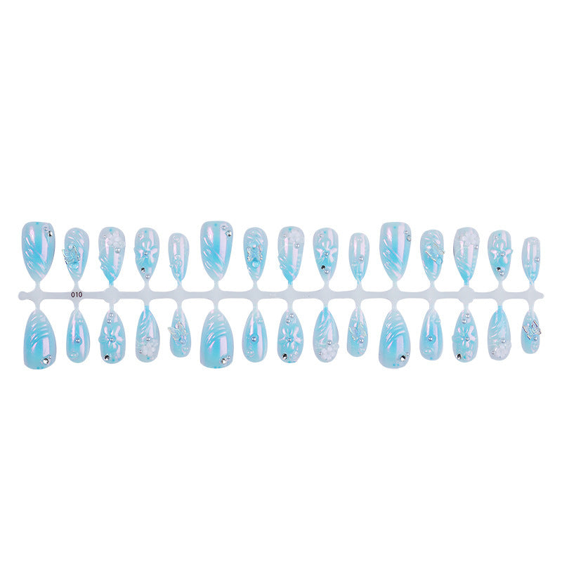 Creative nail set with floral accents and glittering details Kalsten