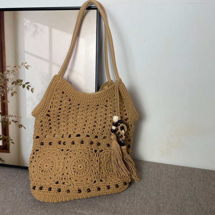 Hand-crocheted shoulder bag with unique fringe design Kalsten