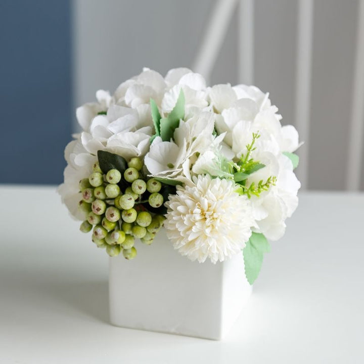 Lifelike Floral Arrangement in Decorative Square Planter