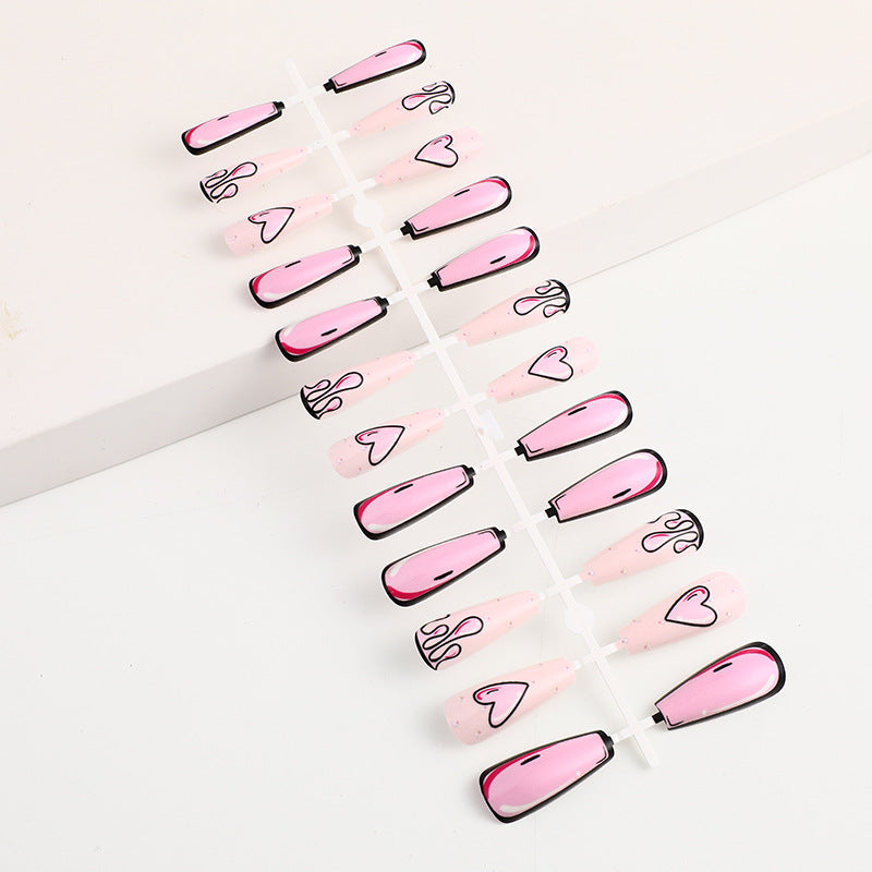 Eye-catching artificial nails with soulful heart design and glamorous accents Kalsten