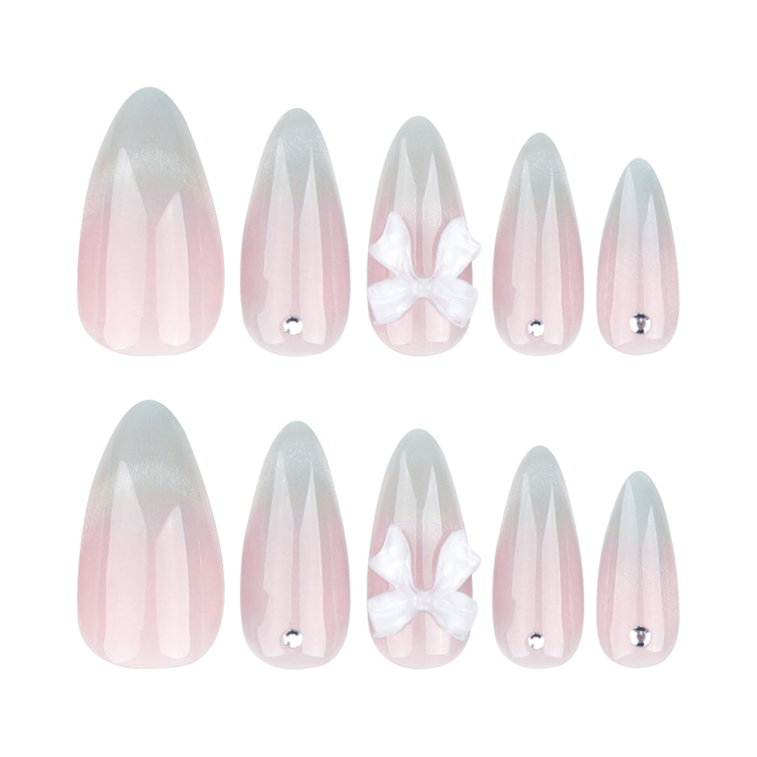Elegant Stiletto Nails with Glitter and Bow Accents Kalsten