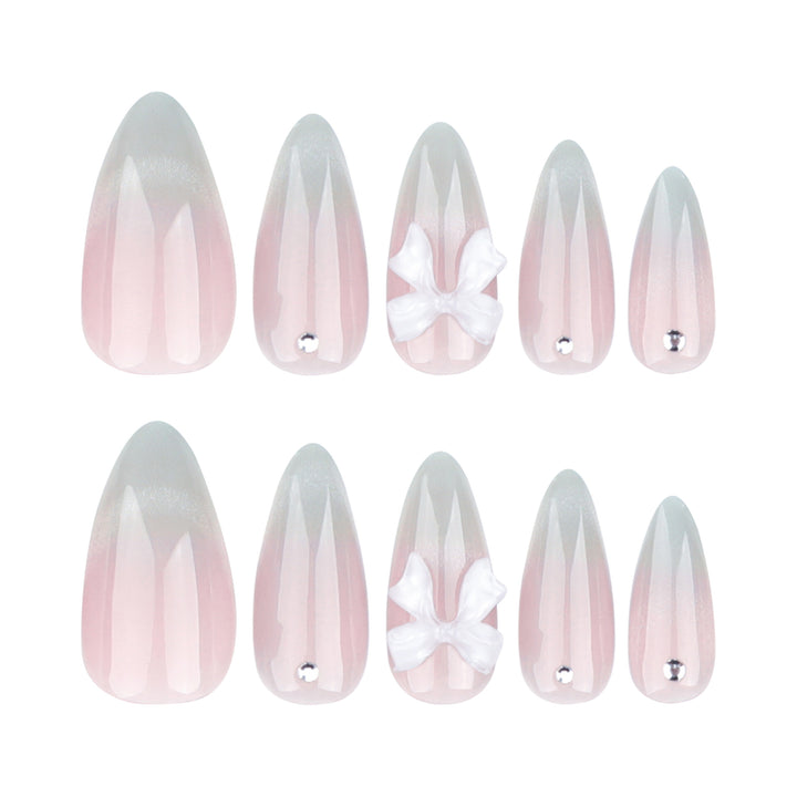 Elegant Stiletto Nails with Glitter and Bow Accents Kalsten