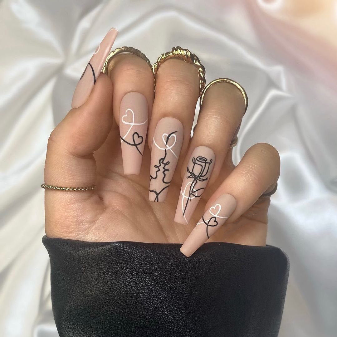 Artful nail extensions with creative line and heart design Kalsten