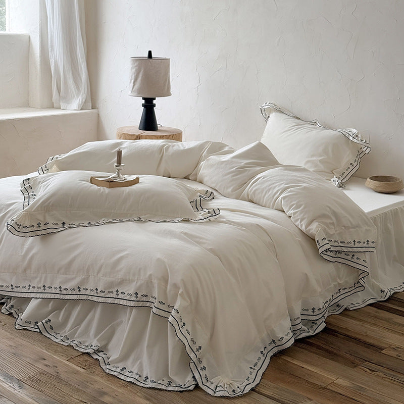 Luxurious embroidered bedding set with ruffled hem