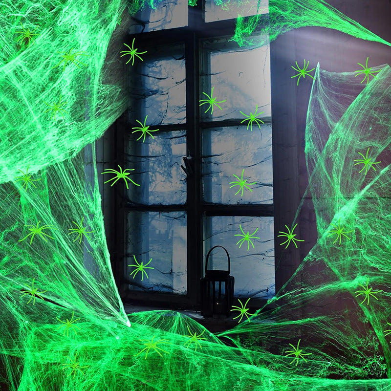 Decorative Halloween spider web with artificial spiders