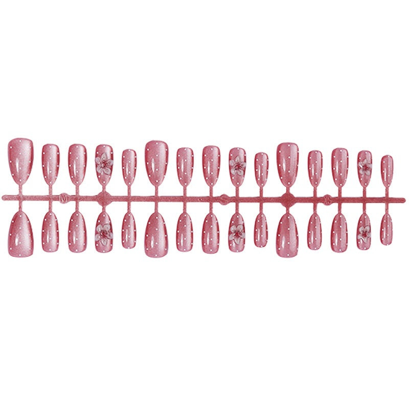 Artificial nail set with glamorous glitter design and floral accent Kalsten