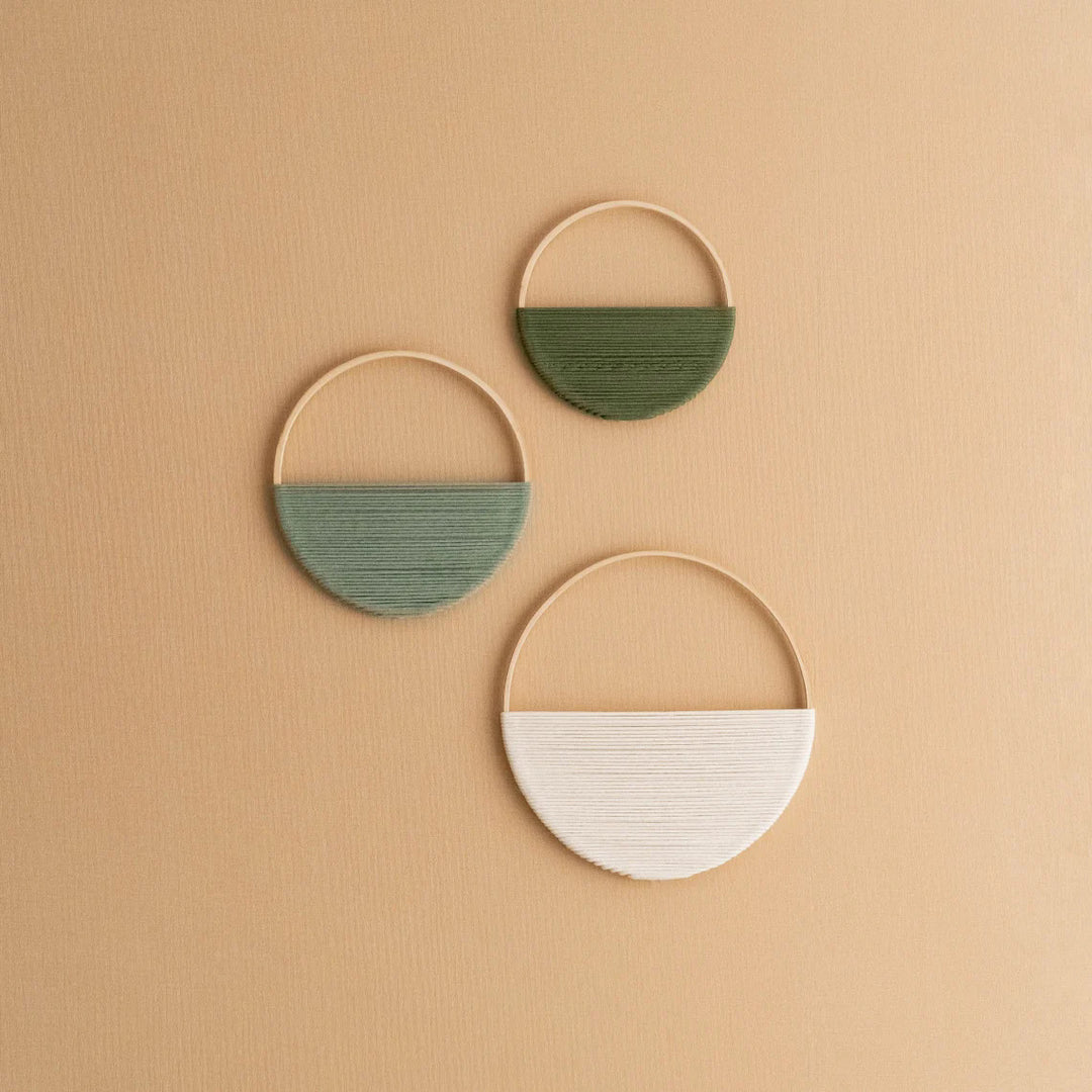 Modern wall art piece made of macrame and wood