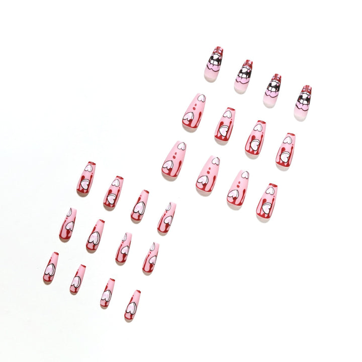 Artificial nail art with heart-shaped design and matte finish Kalsten