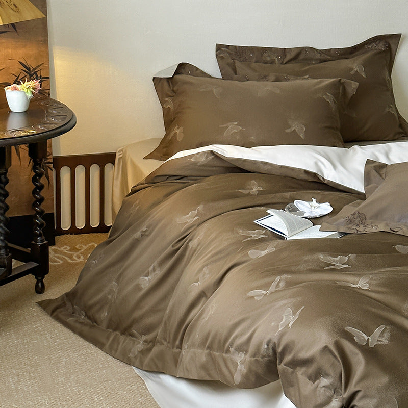 Elegant finely woven bedding set made of Mako satin with subtle butterfly jacquard structure and reversible pillowcase