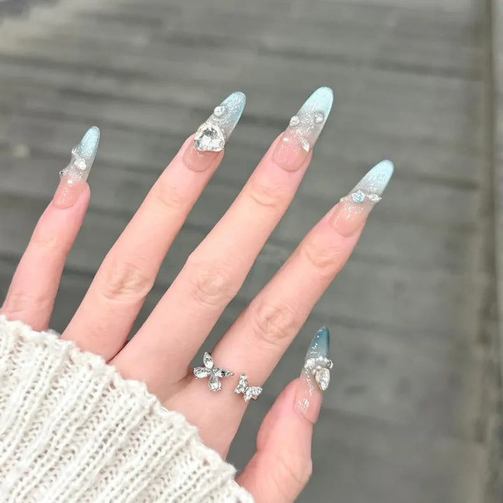 Artistic Press-On Nail Design with Floral and Glitter Accents Kalsten