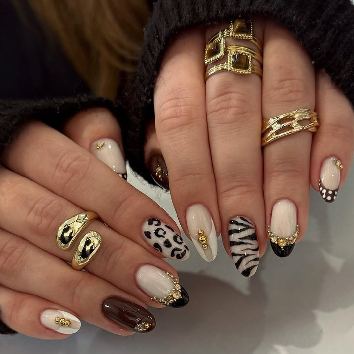 Acrylic nail set with luxurious animal motif designs and glamorous accents Kalsten
