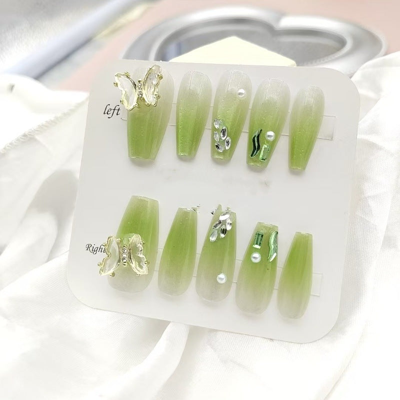 Artificial nails with butterfly accents and glitter details Kalsten