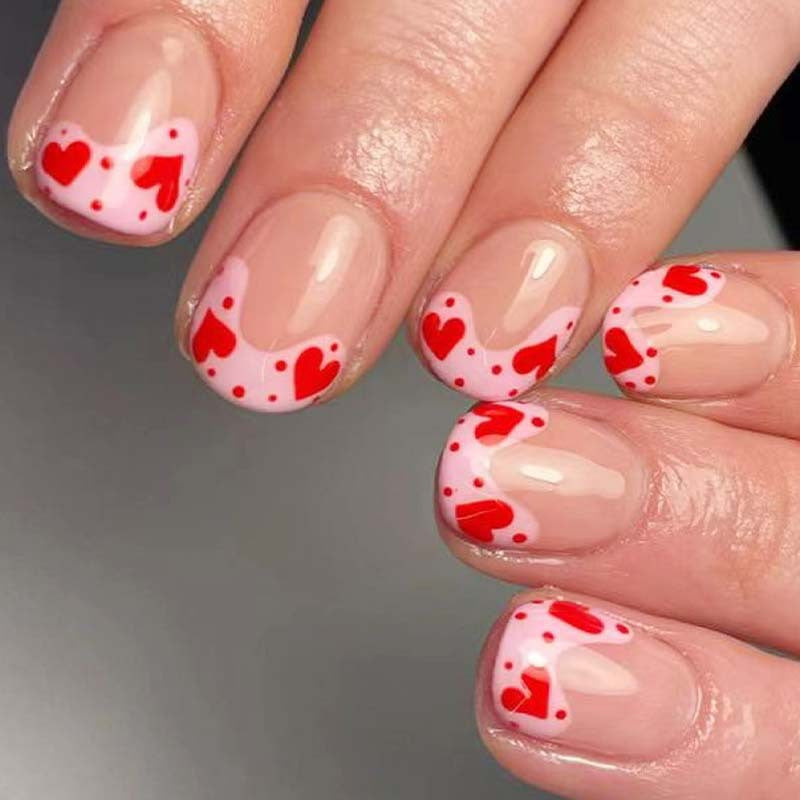 Artfully designed nail tips with heart motifs Kalsten