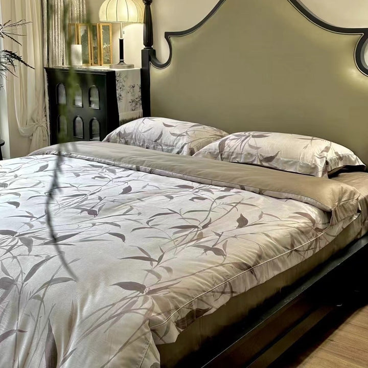 Bedding set made of cotton satin with botanical bamboo leaf print and reversible pillowcases