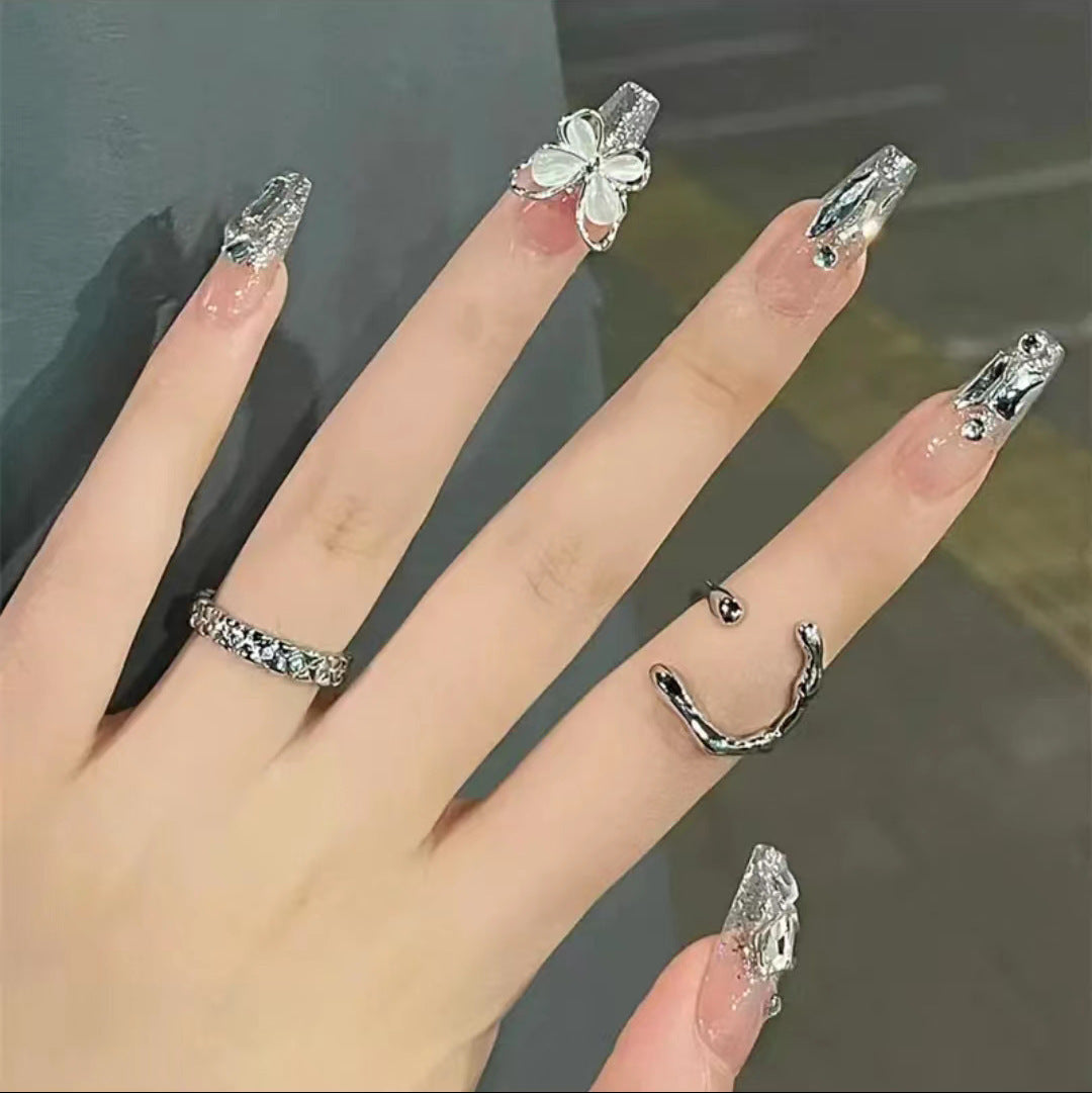 Artful Nail Art with Glitter and Butterfly Elements Kalsten