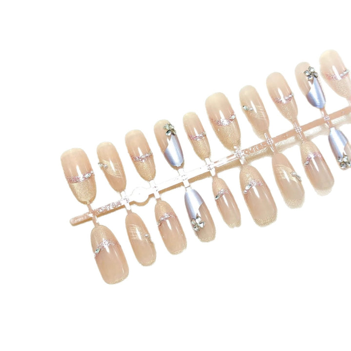 Artificial nails with modern glitter and stone embellishments Kalsten