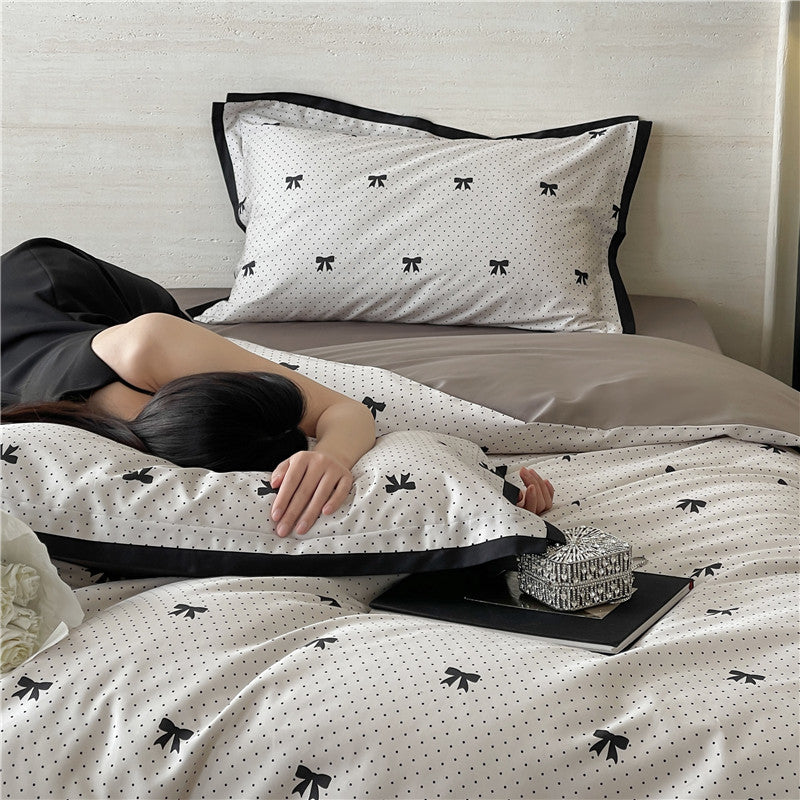 Luxurious cotton satin bedding set with butterfly motif and contrasting frame edge