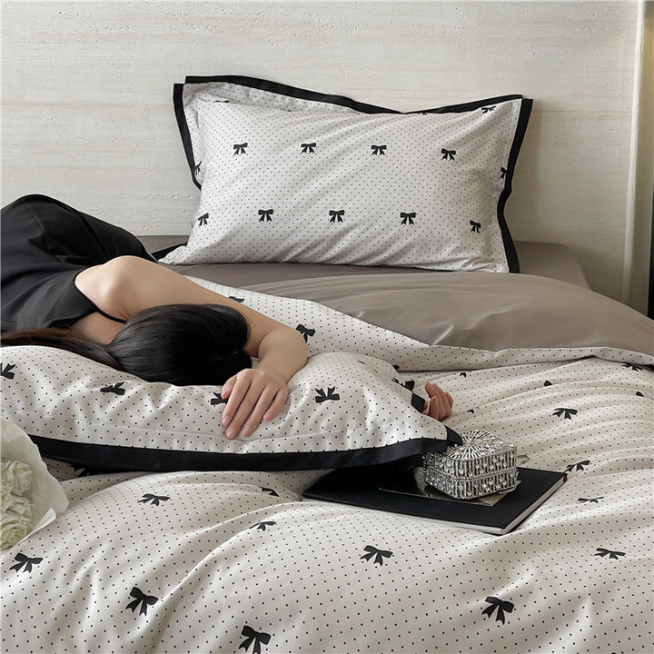 Luxurious cotton satin bedding set with butterfly motif and contrasting frame edge