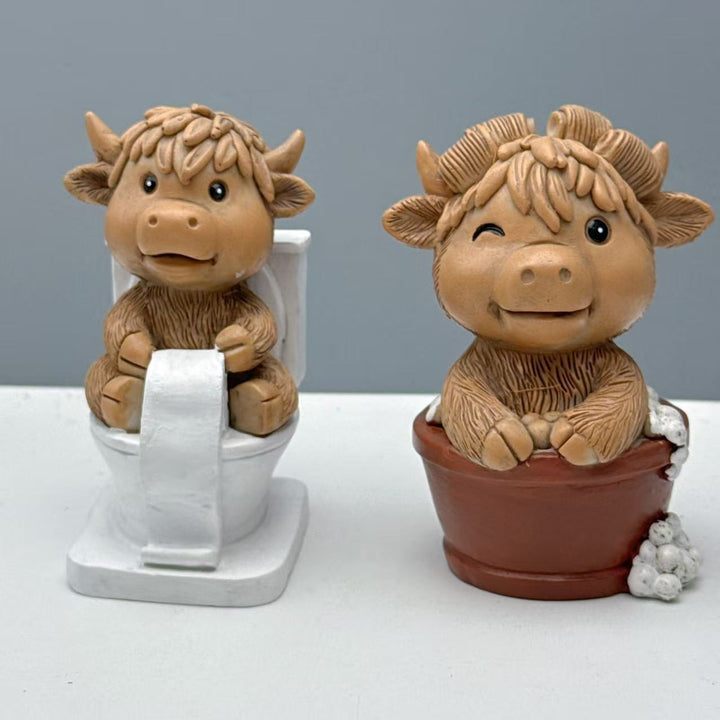 Funny decorative figure of a Highland cow on toilet Kalsten