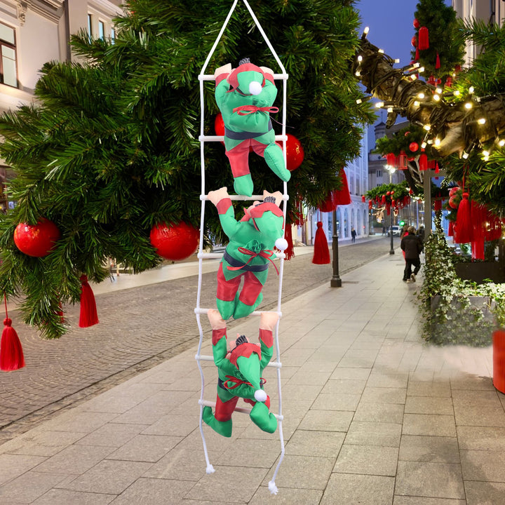 Inflatable Santa Claus figures climbing ladder