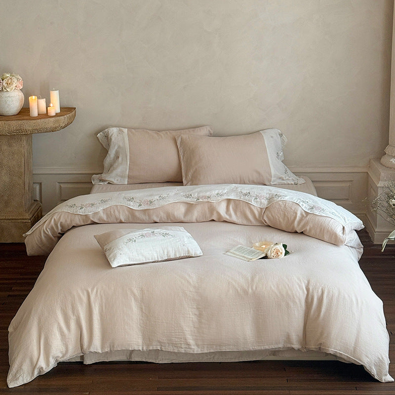 Bedding set made of washed linen with floral embroidery border
