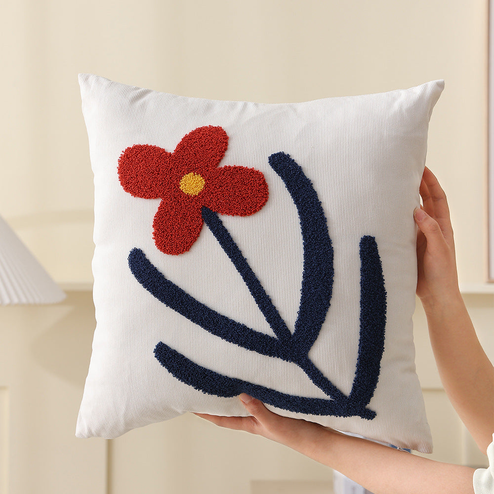 Square decorative cushion with hand-tufted heart ornament and contrasting border