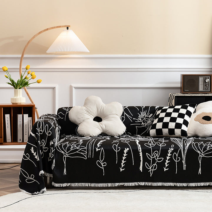 Fine woven sofa cover and furniture throw with floral line drawing and decorative fringed edge Kalsten