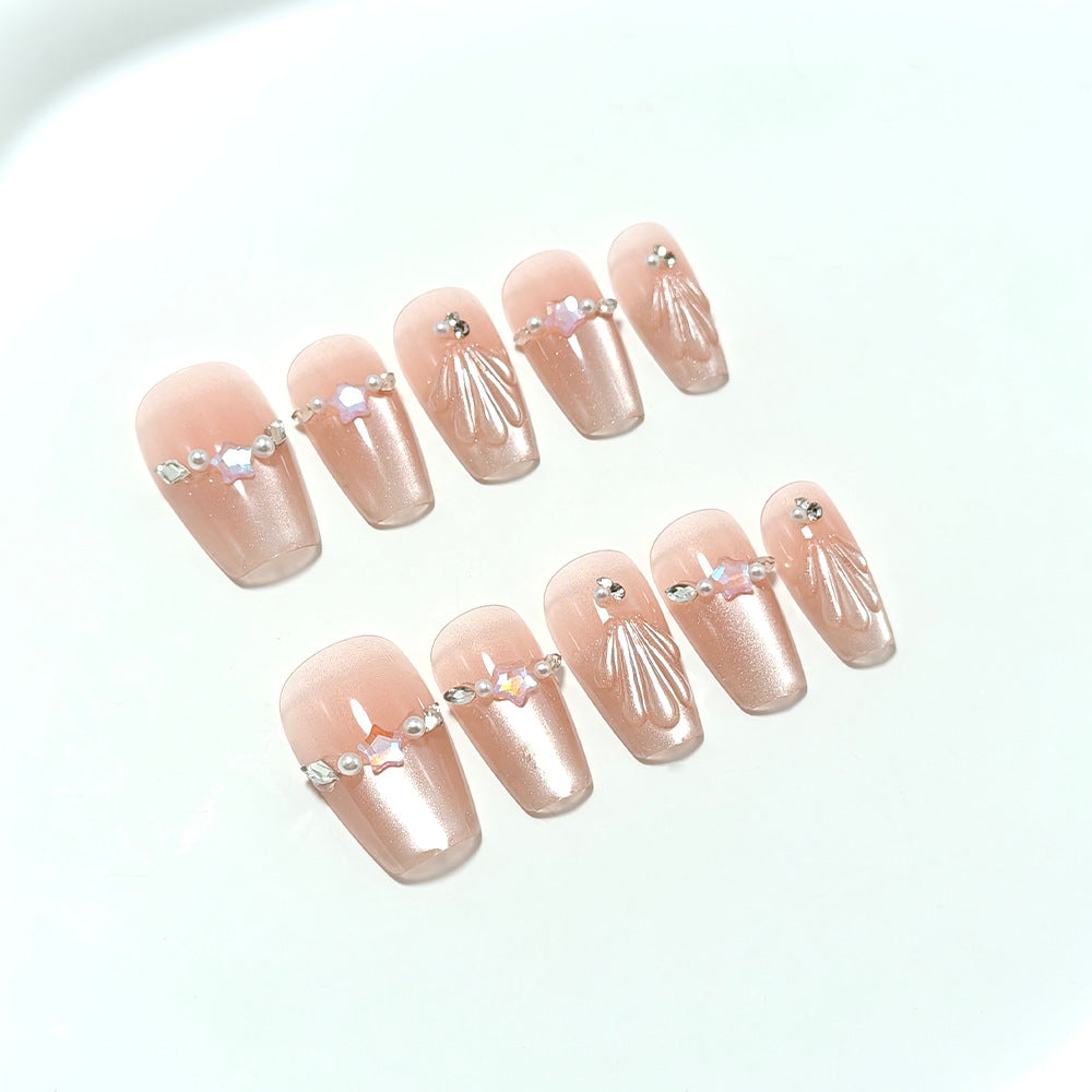 Exquisite artificial nails with glitter and pearl accents Kalsten