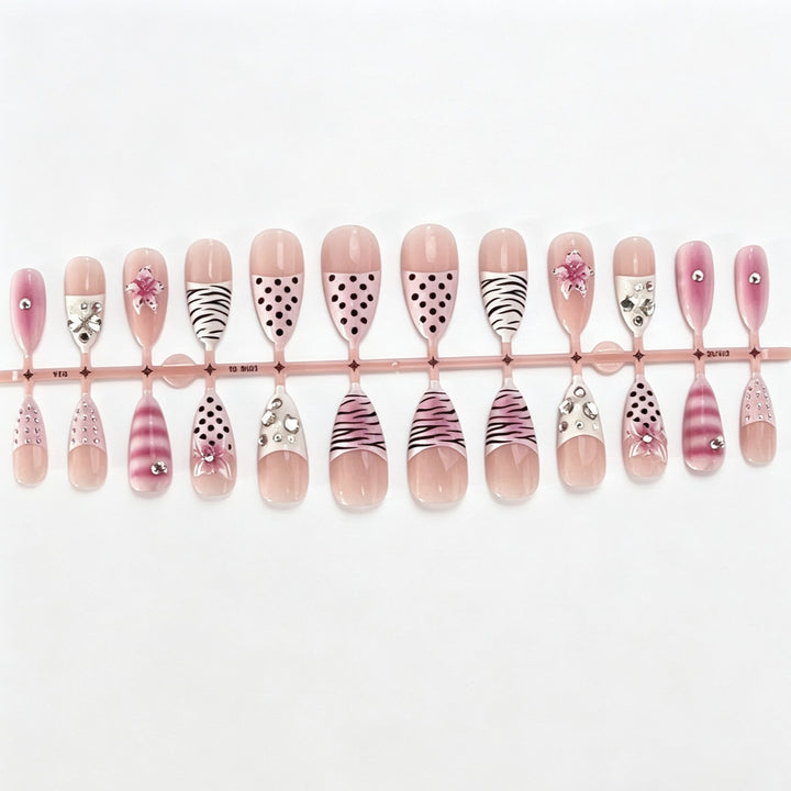 Artistic Press-On Nail Design with Unique Patterns and Rhinestone Accents Kalsten