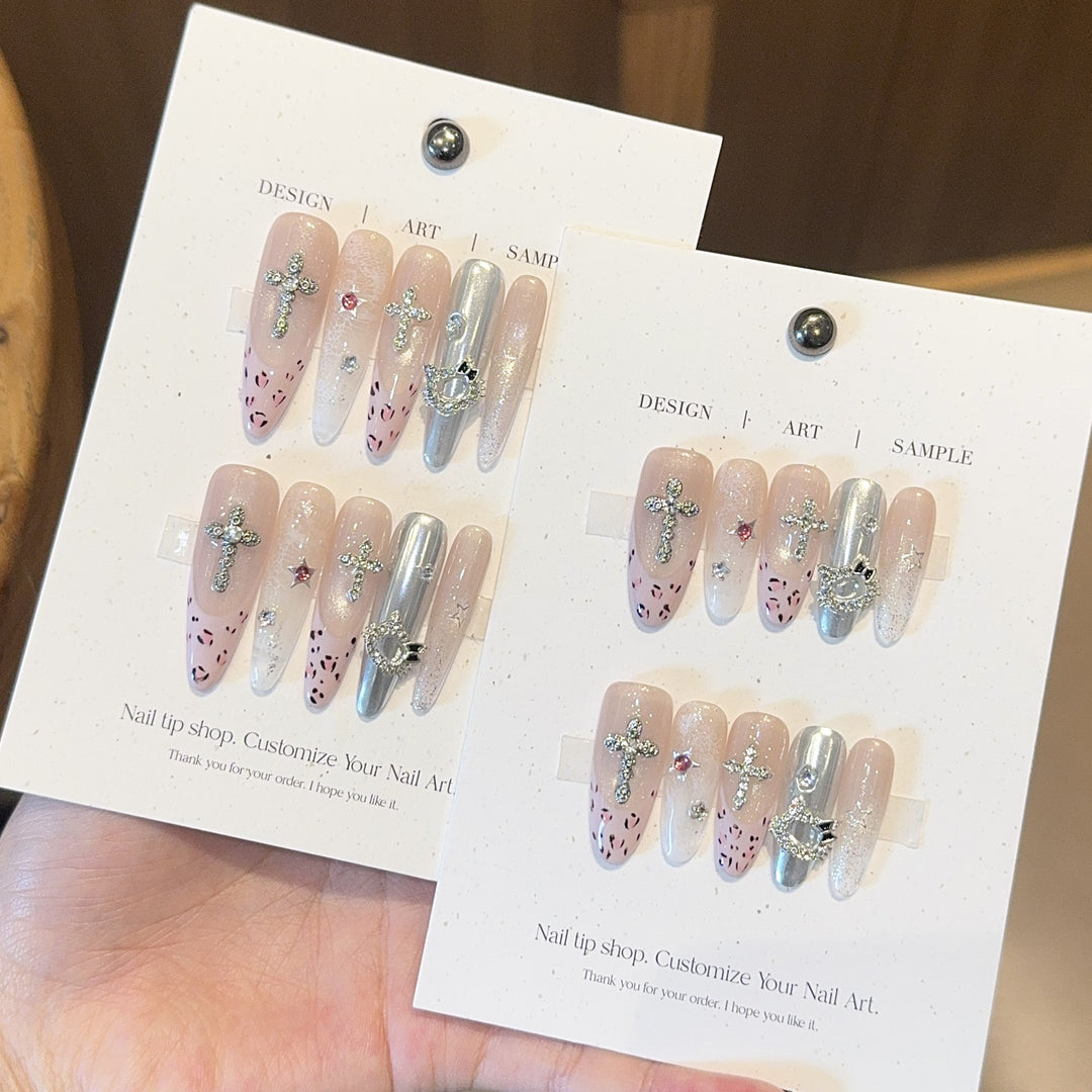 Artificial nails with sparkling rhinestones and cross motifs Kalsten
