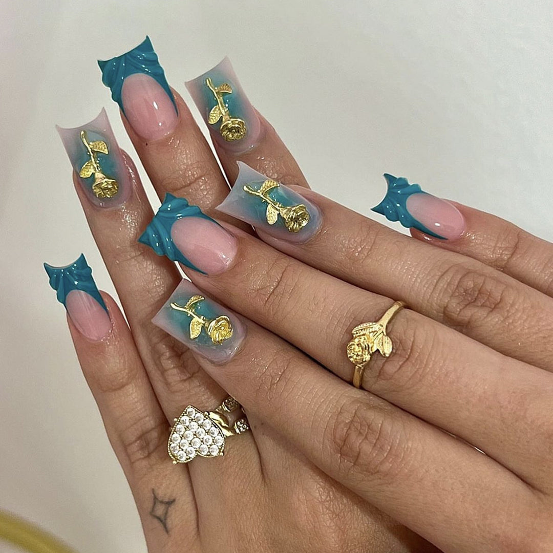 Elegant artificial nail creations with golden embellishments Kalsten